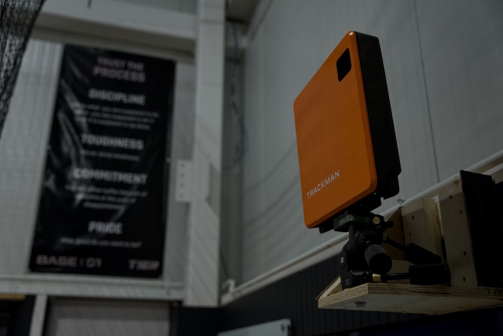 A ball-tracking unit mounted in a cage